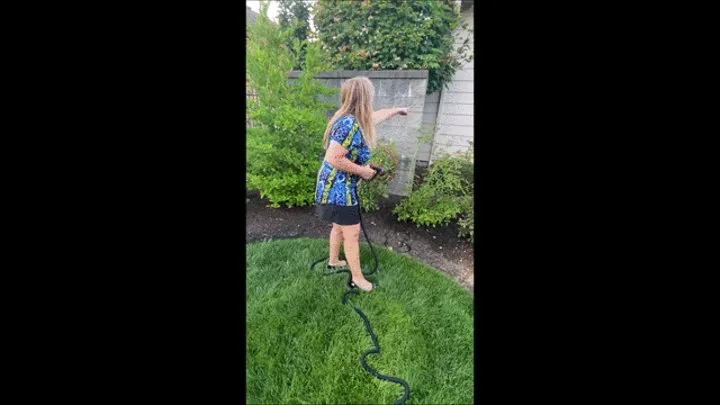 Watch Sexy Gardner Deb Watering Her Landscape Wearing Her Black Mini Skirt with Black Anne Klein Ballet Flats (7-27-2021) C4S