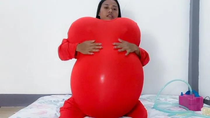 Sexy Camylle Stuffs Her Red Jumper With Balloon Boobs And Belly Then Pops Them