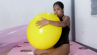 Sexy Stella Blows To pop A HUGE, Yellow Tuftex Balloon.