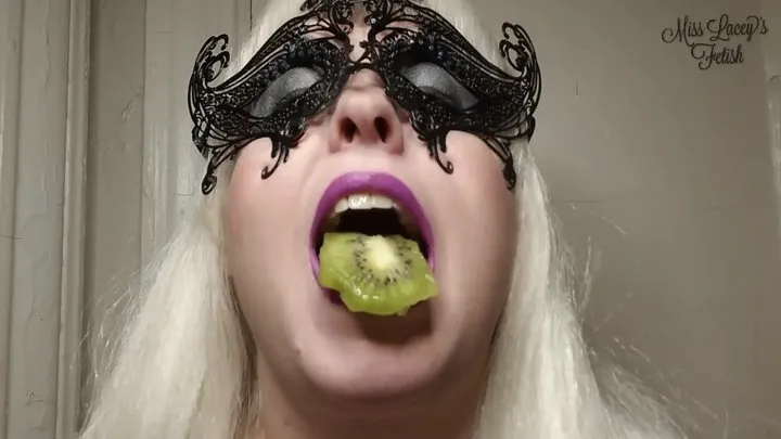Miss Lacey Chewing Up and Swallowing Two Juicy Kiwi Fruits Wearing Purple Lipstick
