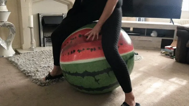 Inflatable melon beach ball over inflation then sharp pop