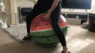 Inflatable melon beach ball over inflation then sharp pop