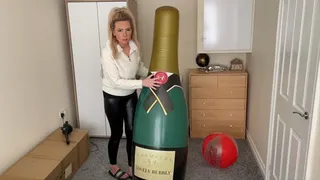 Giant champagne bottle sit pop