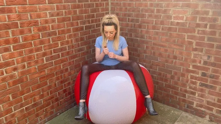 Giant beach ball smoking cigarette popping plus high heels