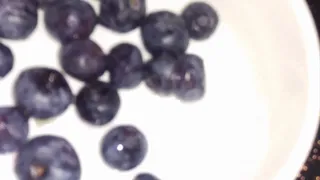 crushing blueberries with my hand