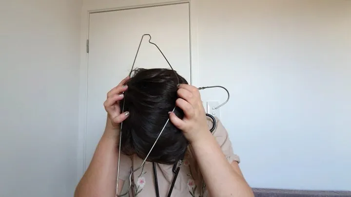 Angel Gets Head Stuck in Coat Hangers