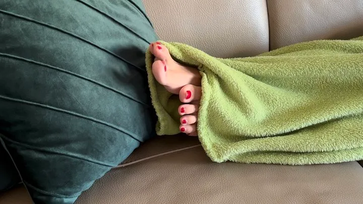 SEXY TOES WITH RED NAIL POLISH PEEKING UNDER THE BLANKET