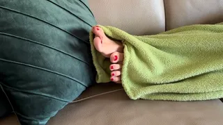 SEXY TOES WITH RED NAIL POLISH PEEKING UNDER THE BLANKET