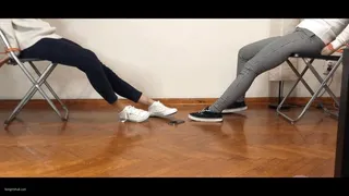 TWO GIRLS TIED UP IN CONVERSE SNEAKERS ARE STRUGGLING TO REACH A ON THE FLOOR - MOV HD