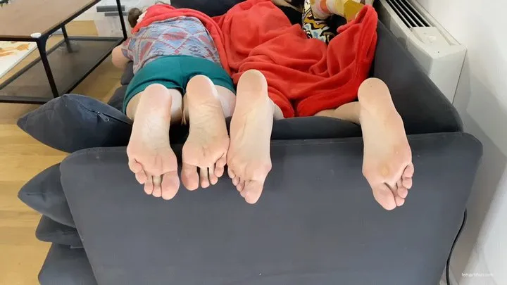 TWO GIRLS FEET FLIRTING FOOTSIE PLAY ON A SOFA