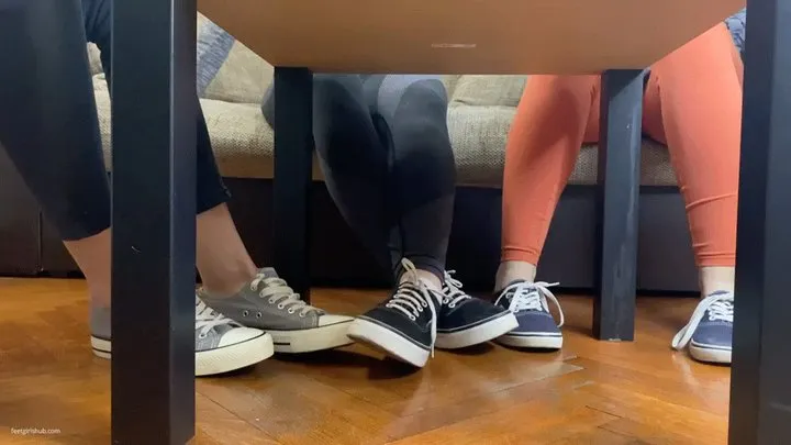 TWO GIRLS PLAYING SECRET FOOTSIE UNDER THE TABLE HIDING FROM JEALOUS GIRLFRIEND