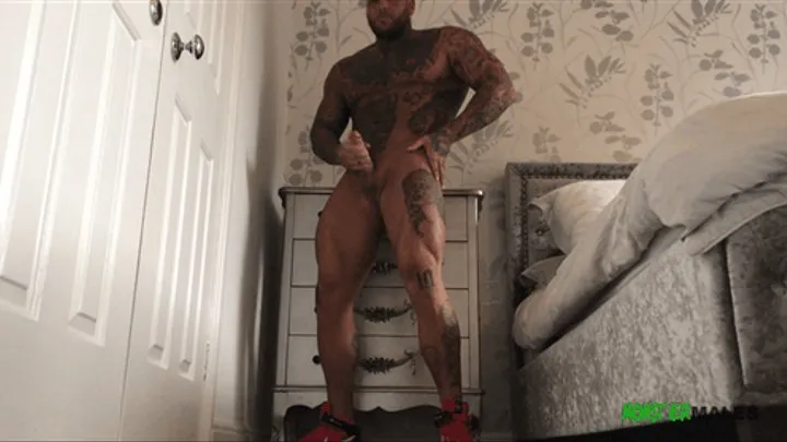 Tattooed big dick British stud Kane Turner jerks and cums wearing sneakers