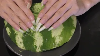 Tapping and scratching the watermelon with my nails