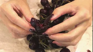 Crush and slice the cherry with long burgundy nails