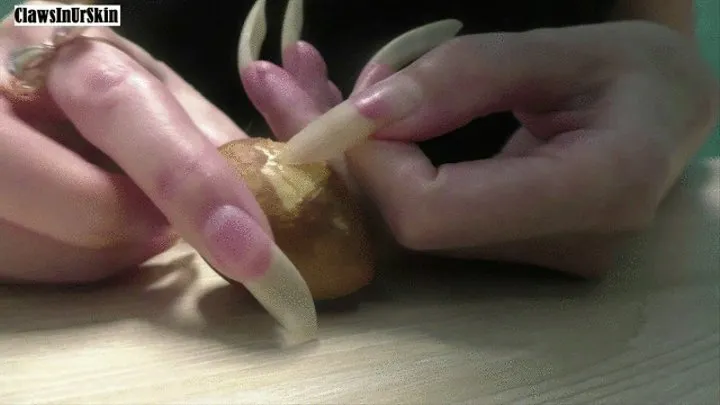 nails scratching an avocado pit