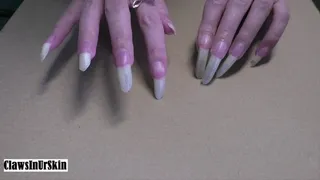 hard scratching and piercing the cardboard with my nails