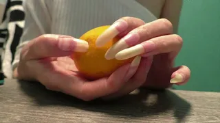 Clawing and crush lemon with nails