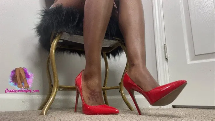 Red stiletto pump heel dangle