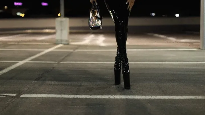 Goddess Slavena is walking in the city in latex with highboots