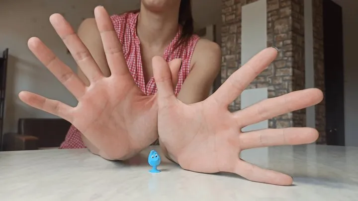 Little toys in Alex's giant hands
