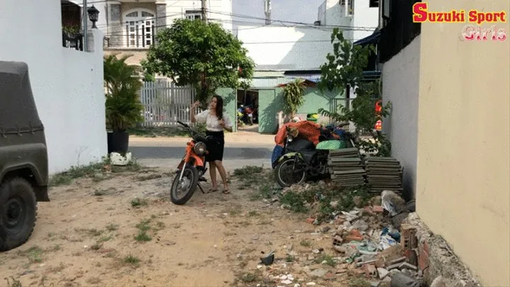 Phuong cranking her big motorbike and try to fix it