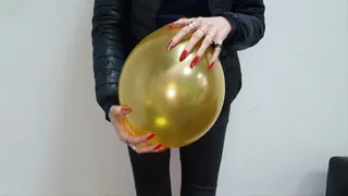 Red nails pierce the balloon and the presentation of long red nails
