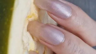 Scratching zucchini with long natural nails