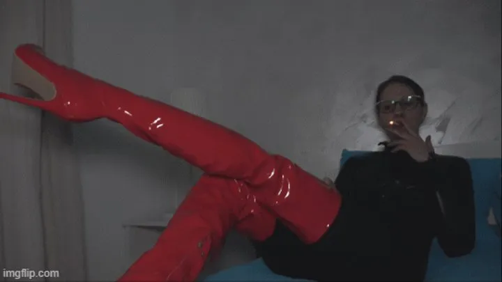 A girl in latex boots and catsuits smoking