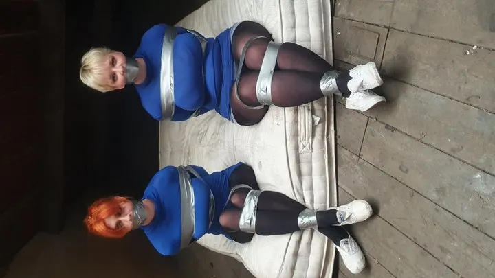 1300 Amber and Roxie in Blue Tops and Silver Tape