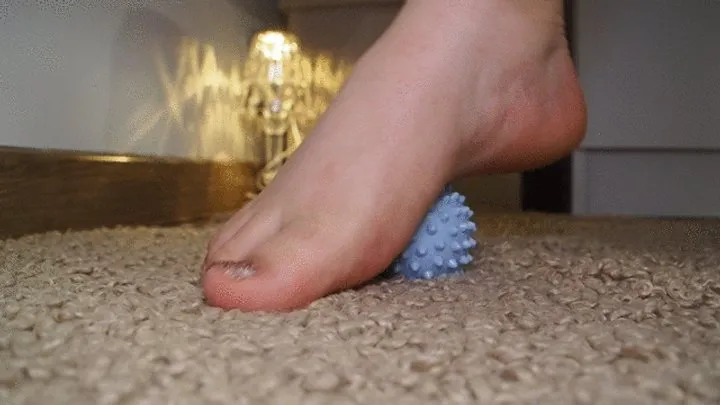 Playing with feet and massage ball: blue relax