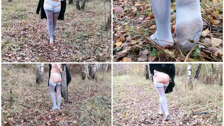 Nylon nymph is walking in two pairs of stockings in the forest