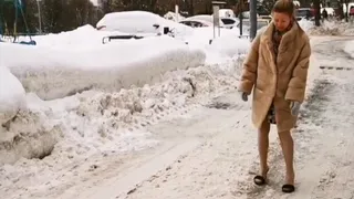 Emily on two pairs of high heel mules on the slippery road and ice rink