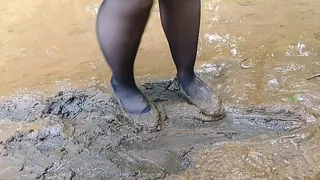 Girl in ballet flats slips hard on muddy surface