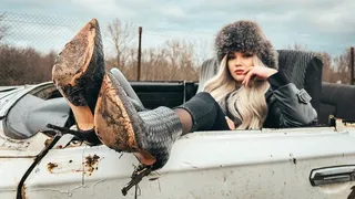 CAR STUCK Blonde gets convertible stuck in mud on way to party