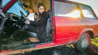 CAR STUCK Two friends got stuck on a muddy road