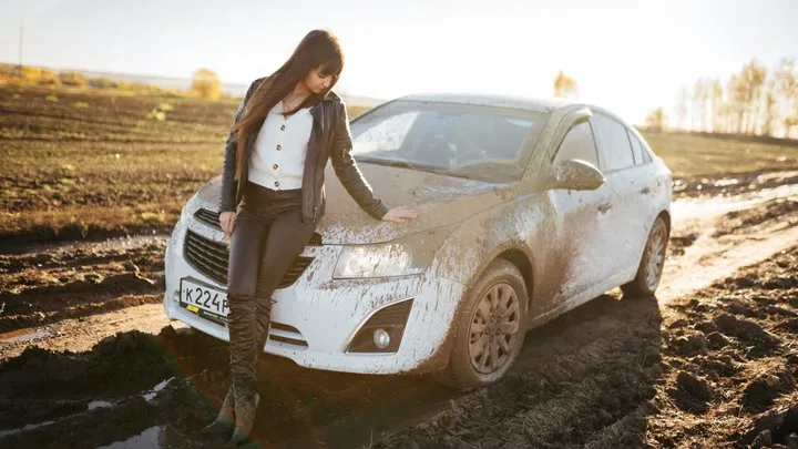 CAR STUCK Maria stuck in the mud choosing the wrong path