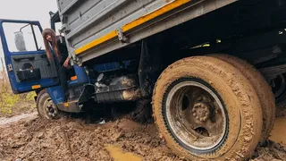CAR STUCK Stuck on a truck in the mud trying to turn around