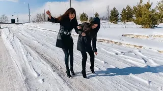 78 Tanya and Maria walk in slippery shoes in the snow