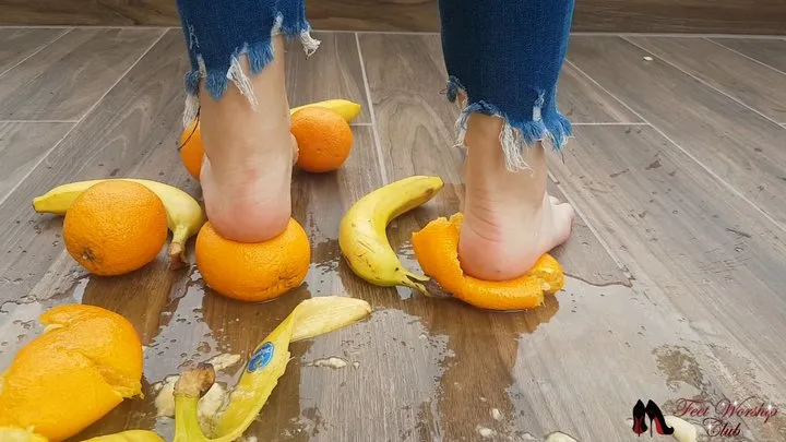 Crushing bananas and oranges on the balcony bare feet