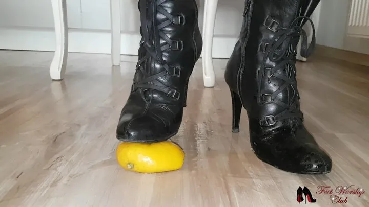 High heels crushing lemon