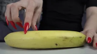 Long nail scratching banana