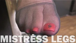 Enticing red toenails in black sheer nylon closeups