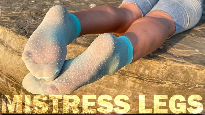 Sexy Soles In Cute Turquoise Nylon Socks On The Seashore At Sunset