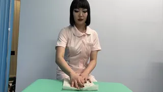 Asian Sakae in nurse's uniform and gloves giving a hand job