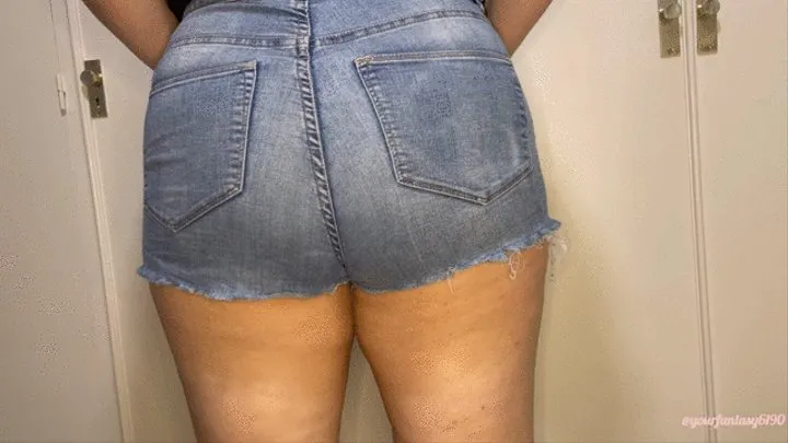 Farting in short jeans close-up