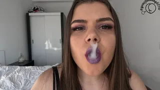 Smoking and vaping with purple shiny lipstick