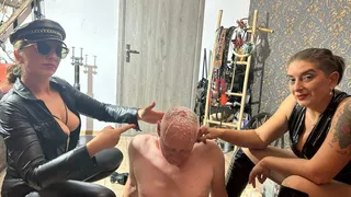 Hot waxing the bald head of the prisoner