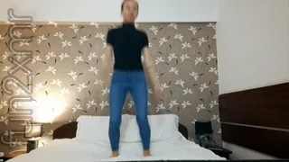 Jumping in the hotel's bed