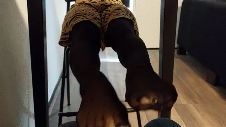 Sandra is teasing the cameraman under the table with her sexy pantyhosed feet