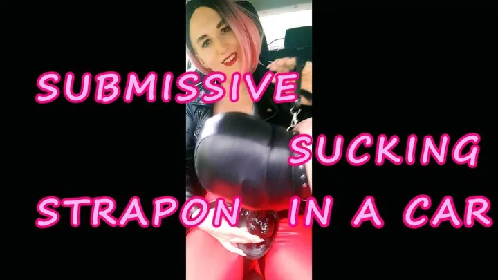 Lady Angela submissive sucking dildo in a car red latex leggings leather